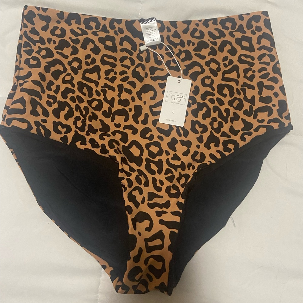 High rise swim bottoms. Size large (12-14) never worn, tags still on